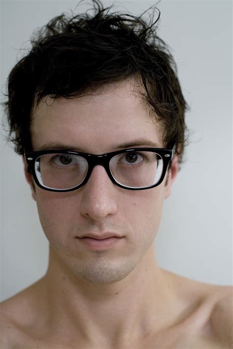 a man wearing glasses|guys wearing very strong glasses.